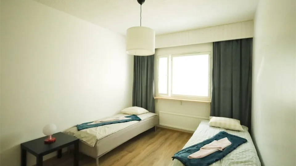 Bedroom with two separate beds in LibO's Takilatie 5 B 8 apartment in Kuopio